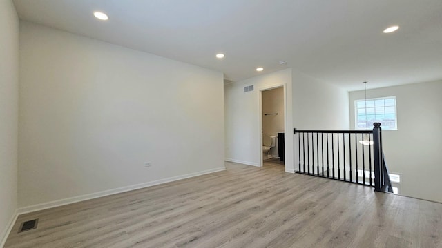 unfurnished room featuring light wood-type flooring