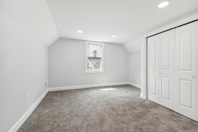 bonus room featuring carpet floors and lofted ceiling