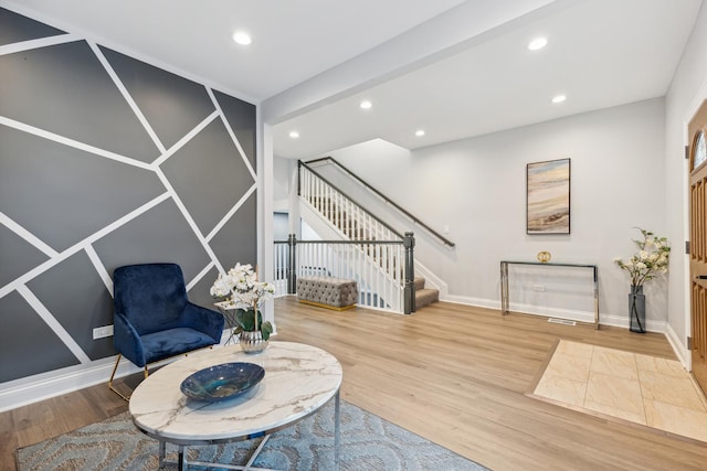 living area with hardwood / wood-style flooring