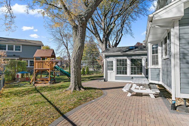 view of yard with a patio area and a playground