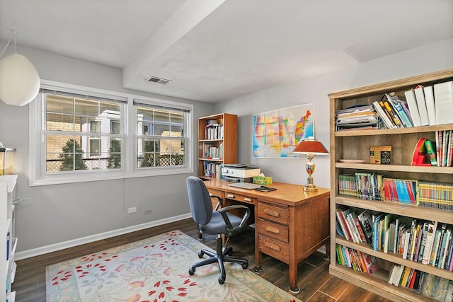 home office with dark hardwood / wood-style flooring