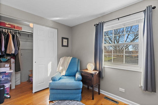 living area featuring hardwood / wood-style floors