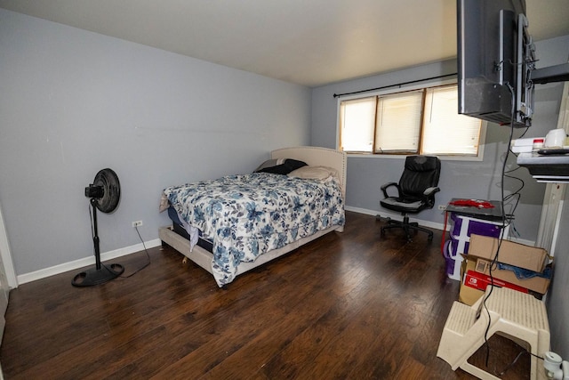 bedroom featuring dark hardwood / wood-style flooring