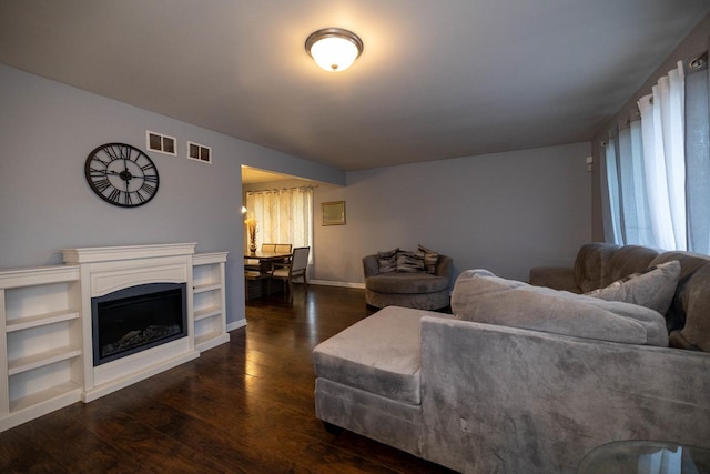 living room with dark hardwood / wood-style floors