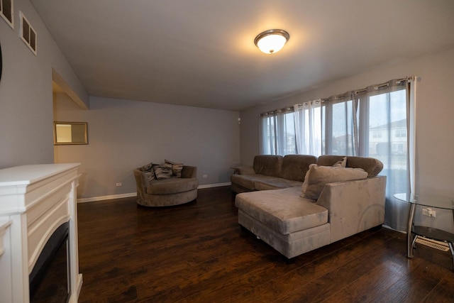 living room with dark hardwood / wood-style floors