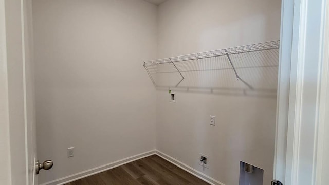 clothes washing area featuring washer hookup and dark hardwood / wood-style floors