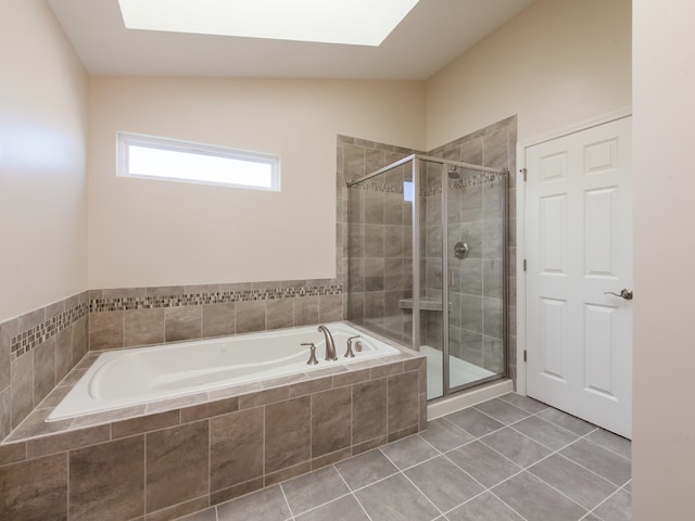 bathroom with tile patterned floors, separate shower and tub, and lofted ceiling