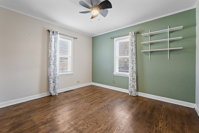 unfurnished room with ceiling fan, ornamental molding, wood finished floors, and baseboards