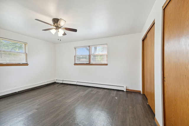 unfurnished bedroom with ceiling fan, dark wood-type flooring, and a baseboard radiator