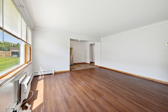 empty room with ornamental molding, dark wood-type flooring, and a baseboard radiator