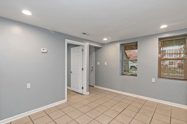 empty room featuring light tile patterned floors