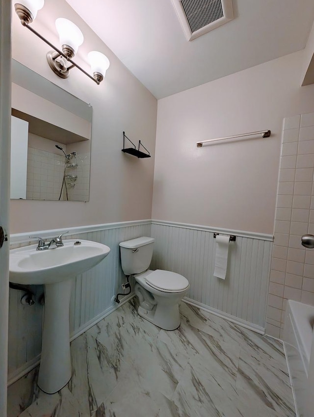 bathroom featuring sink and toilet