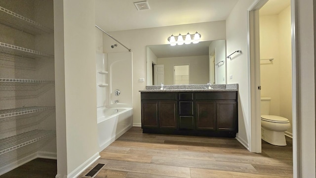 20149 Preston Ln, Lynwood, IL 60411 - bathroom with wood finished floors, bathtub / shower combination, double vanity, and a closet