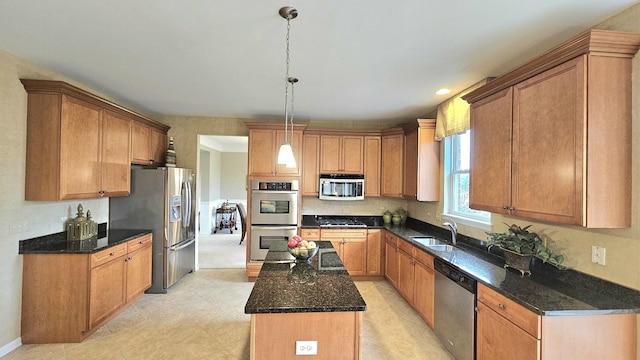 20149 Preston Ln, Lynwood, IL 60411 - kitchen with appliances with stainless steel finishes, a center island, dark stone countertops, hanging light fixtures, and brown cabinetry