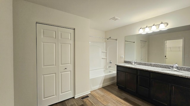 20149 Preston Ln, Lynwood, IL 60411 - bathroom with a closet, washtub / shower combination, double vanity, and wood finished floors