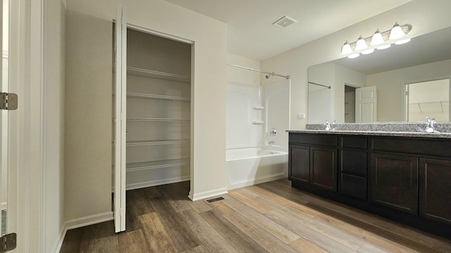 20149 Preston Ln, Lynwood, IL 60411 - full bathroom featuring double vanity,  shower combination, wood finished floors, and a walk in closet