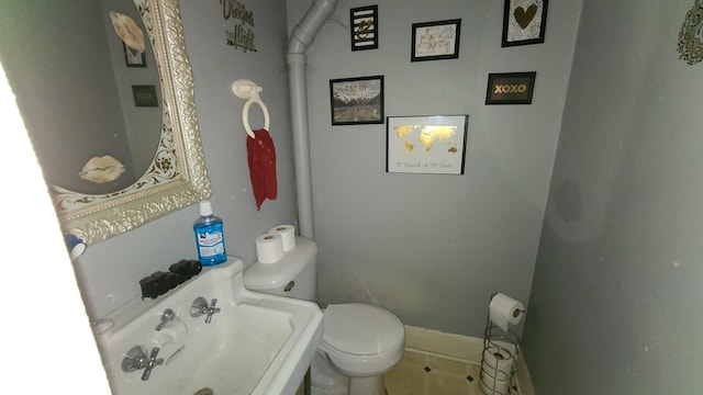 bathroom with toilet and sink