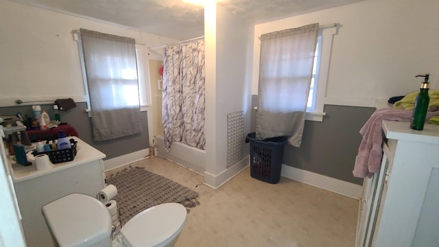 bathroom with shower / tub combo and toilet