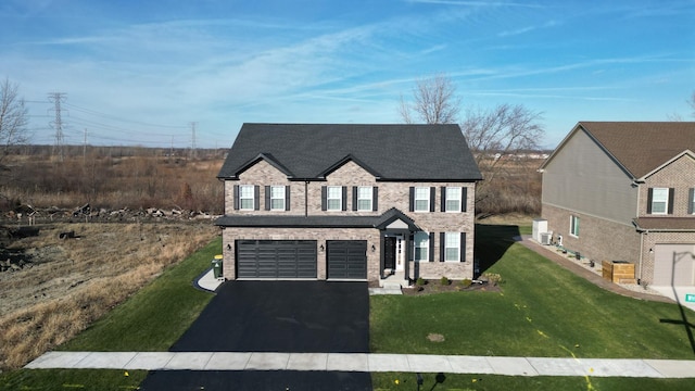 view of front facade with a front lawn and a garage