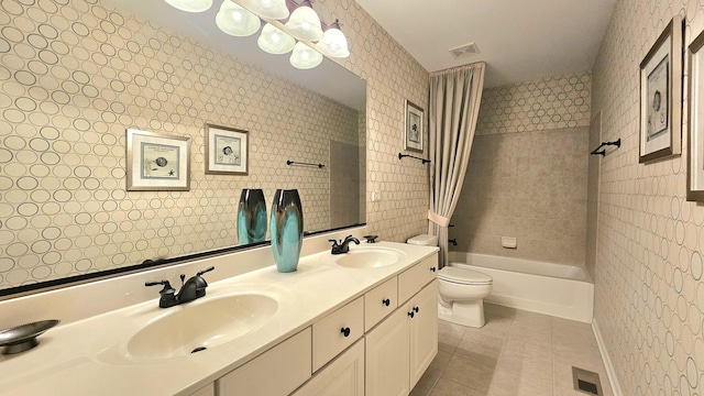 full bathroom with tile patterned floors, vanity, shower / bath combo, and toilet