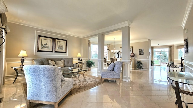 living room with crown molding and a notable chandelier