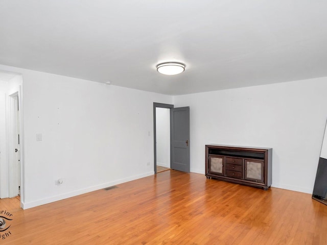 empty room featuring wood-type flooring