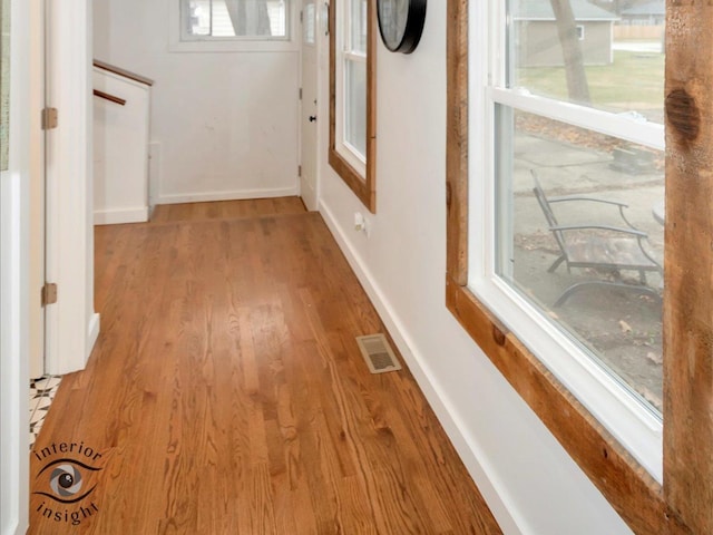 hallway featuring light wood-type flooring