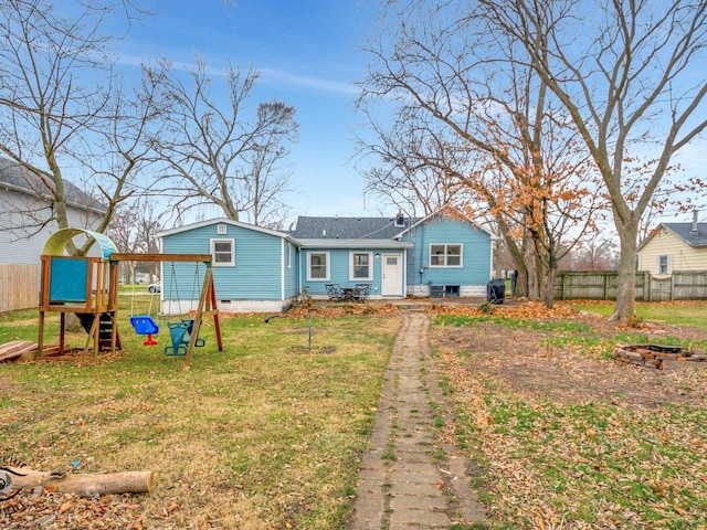 view of front facade with a playground and a front lawn