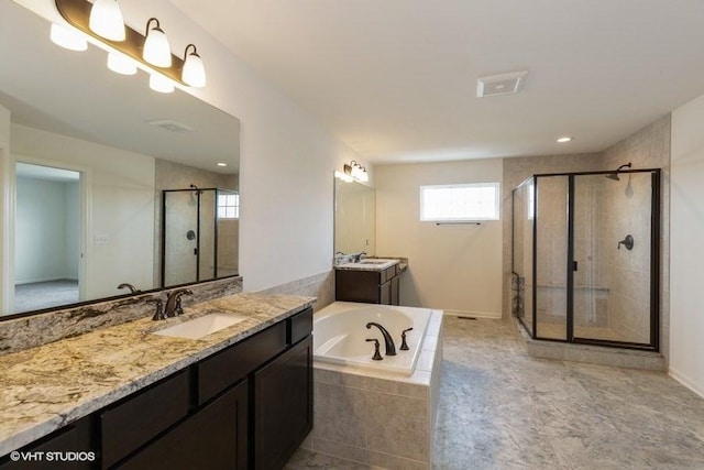 bathroom featuring plus walk in shower and vanity