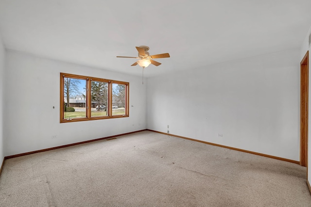 carpeted empty room with ceiling fan