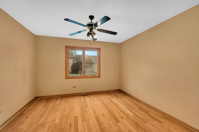 empty room featuring ceiling fan and light wood-type flooring