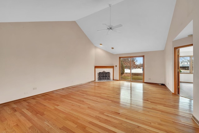 unfurnished living room featuring ceiling fan, high vaulted ceiling, and light hardwood / wood-style flooring