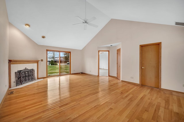 unfurnished living room with ceiling fan, high vaulted ceiling, and light wood-type flooring