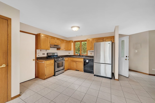 kitchen with sink, light tile patterned floors, and stainless steel appliances