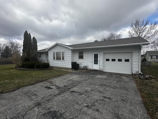 665 W Blue St, Sheldon, IL 60966 - view of front of property with an attached garage, driveway, a shingled roof, and a front yard