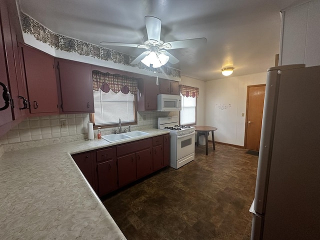 kitchen featuring decorative backsplash, sink, ceiling fan, and white appliances