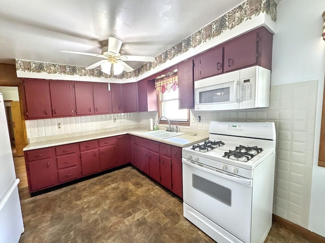 665 W Blue St, Sheldon, IL 60966 - kitchen featuring white appliances, red cabinetry, ceiling fan, and light countertops