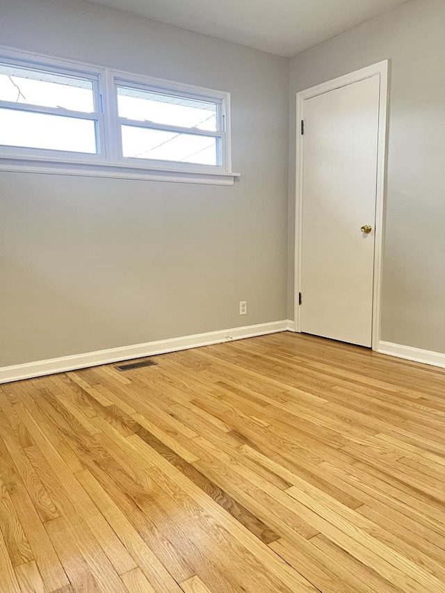 unfurnished bedroom featuring light wood-type flooring