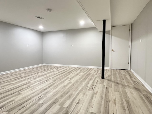 basement featuring light hardwood / wood-style flooring