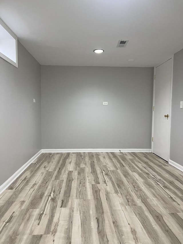 basement featuring light wood-type flooring