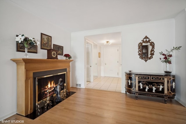 interior space with wood-type flooring and crown molding