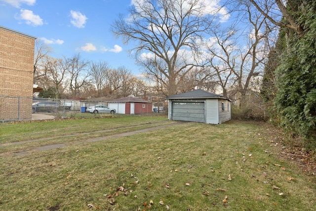 view of yard with a garage and an outdoor structure