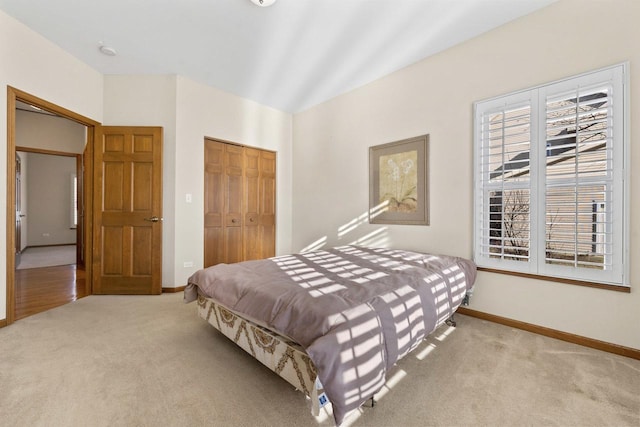 carpeted bedroom featuring a closet