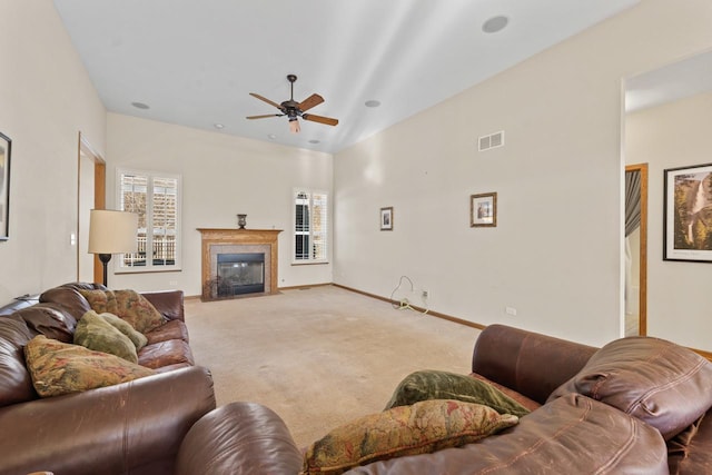 living room featuring ceiling fan and carpet