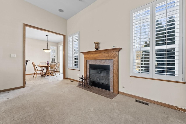 unfurnished living room with light colored carpet