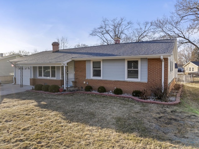 ranch-style house with a garage and a front yard