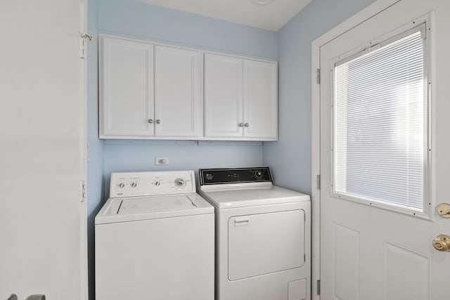 laundry room with cabinets and independent washer and dryer