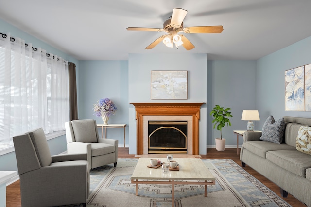 living room featuring ceiling fan and hardwood / wood-style floors