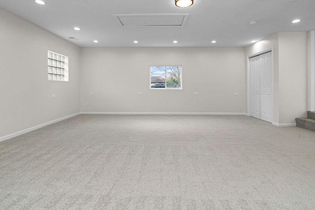 spare room featuring stairway, baseboards, carpet flooring, and recessed lighting