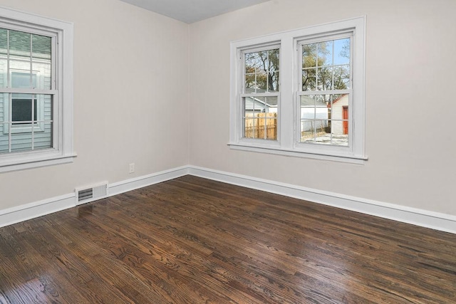 empty room featuring wood-type flooring